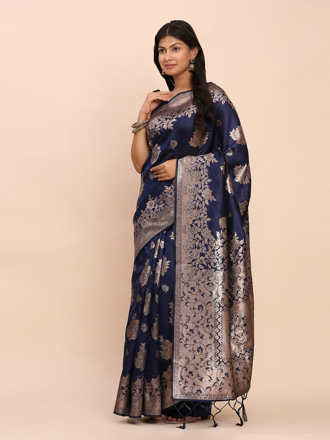 A luxurious navy blue Banarasi silk saree with gold embroidery, featuring a traditional design.