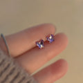 Vera Lux tiny gold heart studs, designed for all-day comfort and sleepable wear.