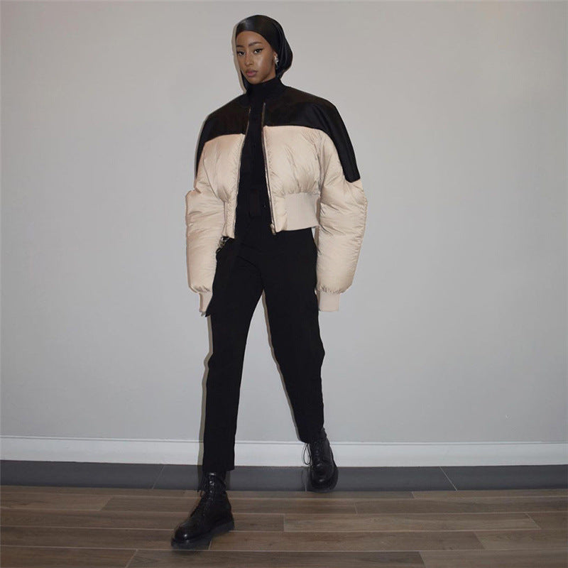 Woman wearing a Harajuku Style two-tone (off-white and black) cropped puffer jacket with a high collar, black pants, and boots. Second image shows a solid black cropped puffer jacket on a mannequin.