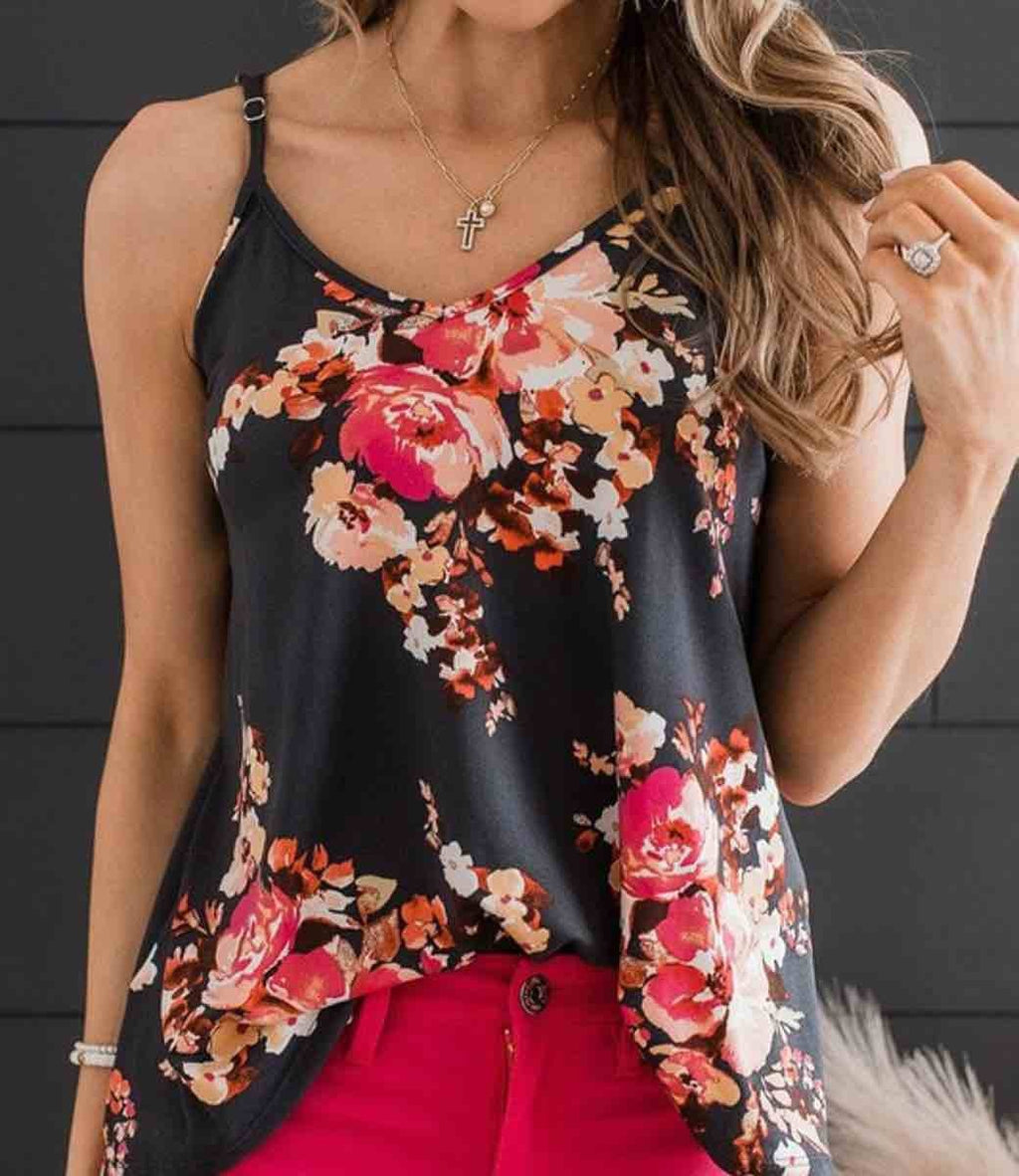 Model wearing a floral print spaghetti strap tank top with a soft, stretchy fabric finish.