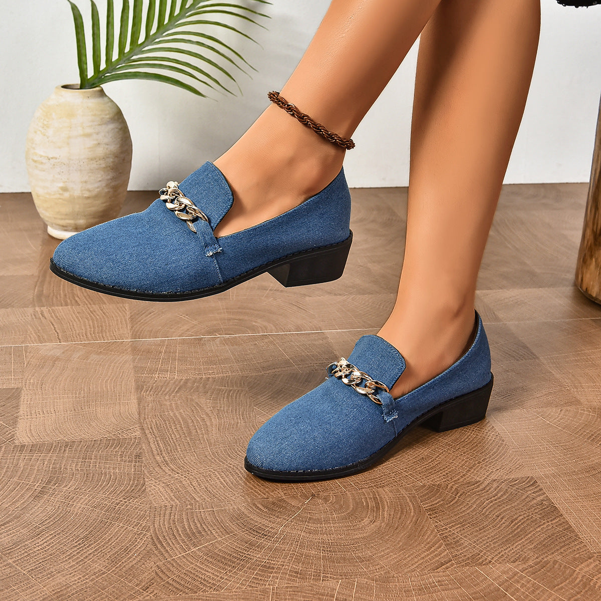 A pair of women's leopard print casual loafers featuring a prominent black bow accent, displayed on a neutral surface.