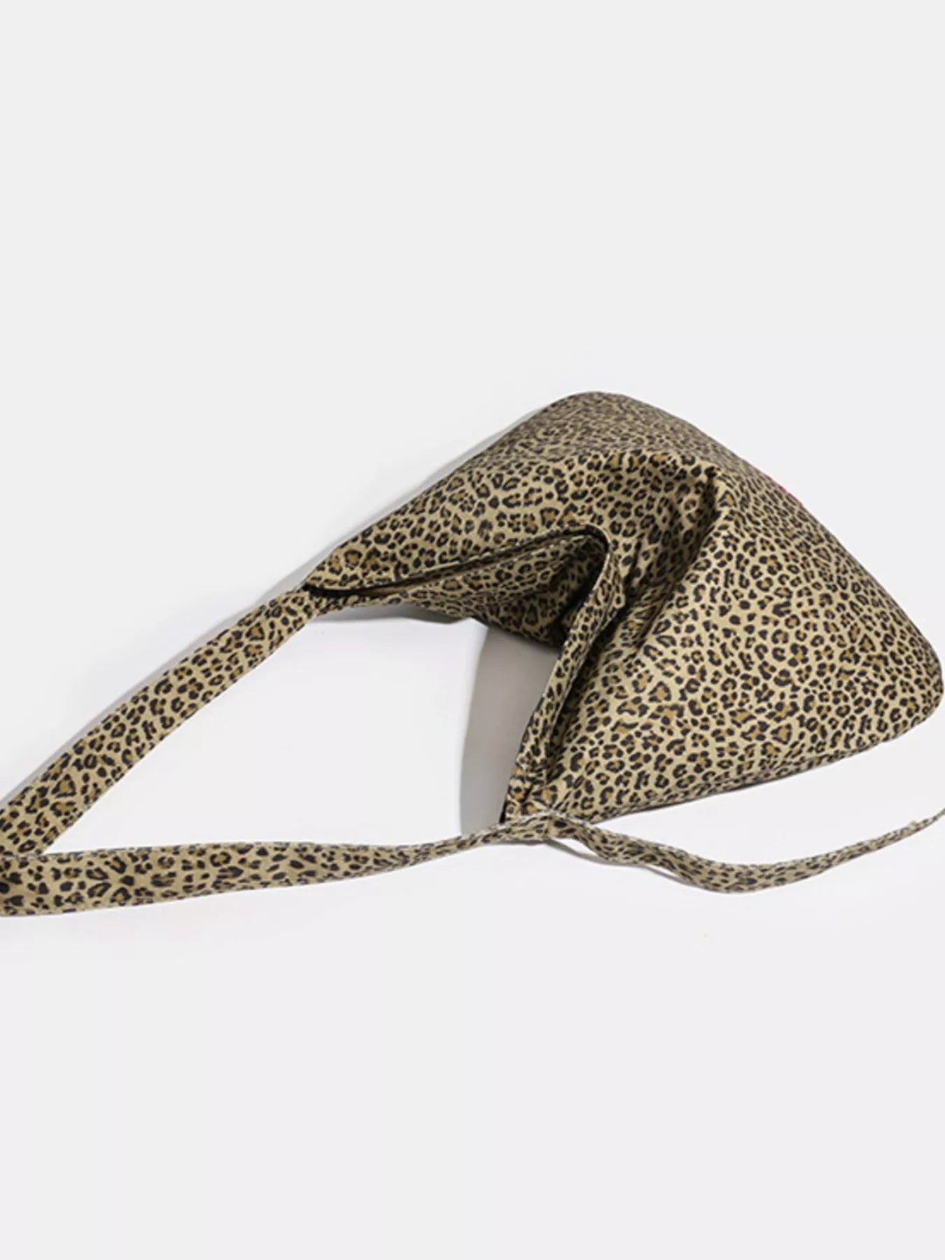 Leopard print headband on a white background