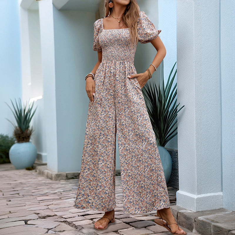 Floral print jumpsuit with square collar and puff sleeves in blue, white, and orange