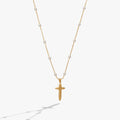 Gold-plated cross pendant with white pearl rosary beads on a delicate chain
