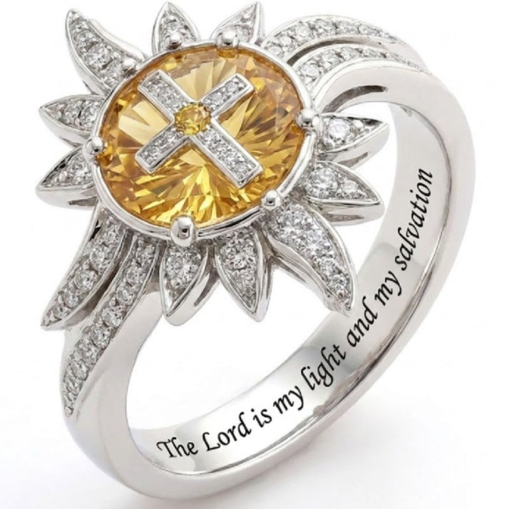 A modern geometric ring with an oval center stone and pave crystal accents in a polished silver finish.