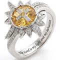 A modern geometric ring with an oval center stone and pave crystal accents in a polished silver finish.
