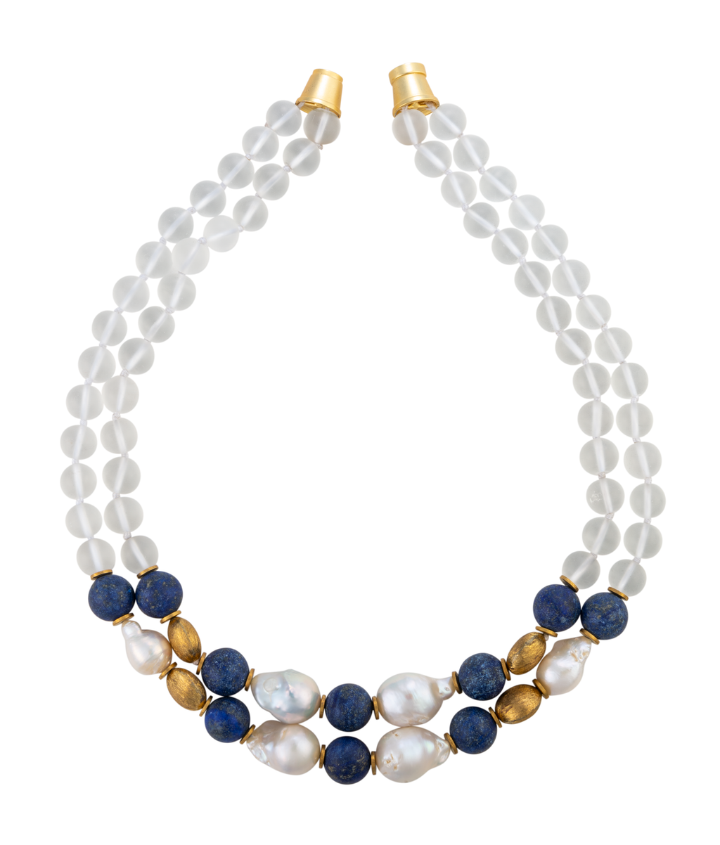 Two-strand necklace featuring frosted glass, blue lapis, textured brass, and white biwa pearls with a gold-tone magnetic clasp.