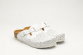 A pair of white perforated leather orthopedic clogs for women featuring an adjustable buckle and cork-style footbed against a plain white background.