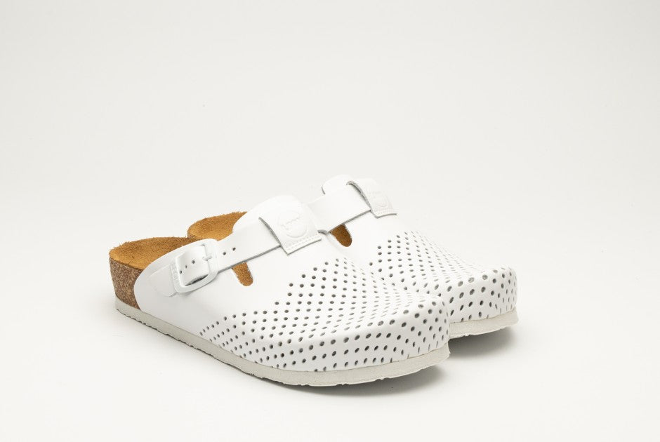 A pair of white perforated leather orthopedic clogs for women featuring an adjustable buckle and cork-style footbed against a plain white background.