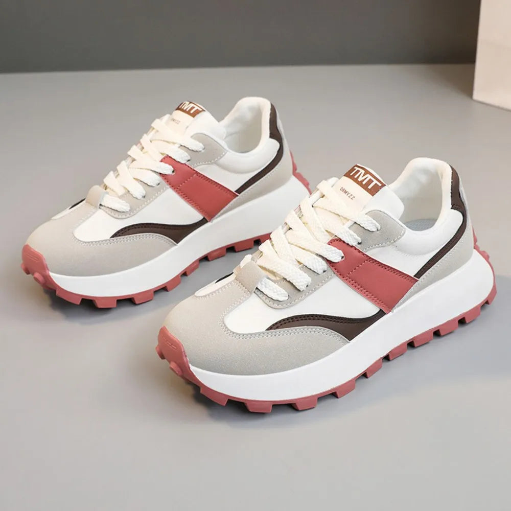 Pair of women's color block platform sneakers in white, grey, pink, and brown, featuring a round toe and lace-up closure.