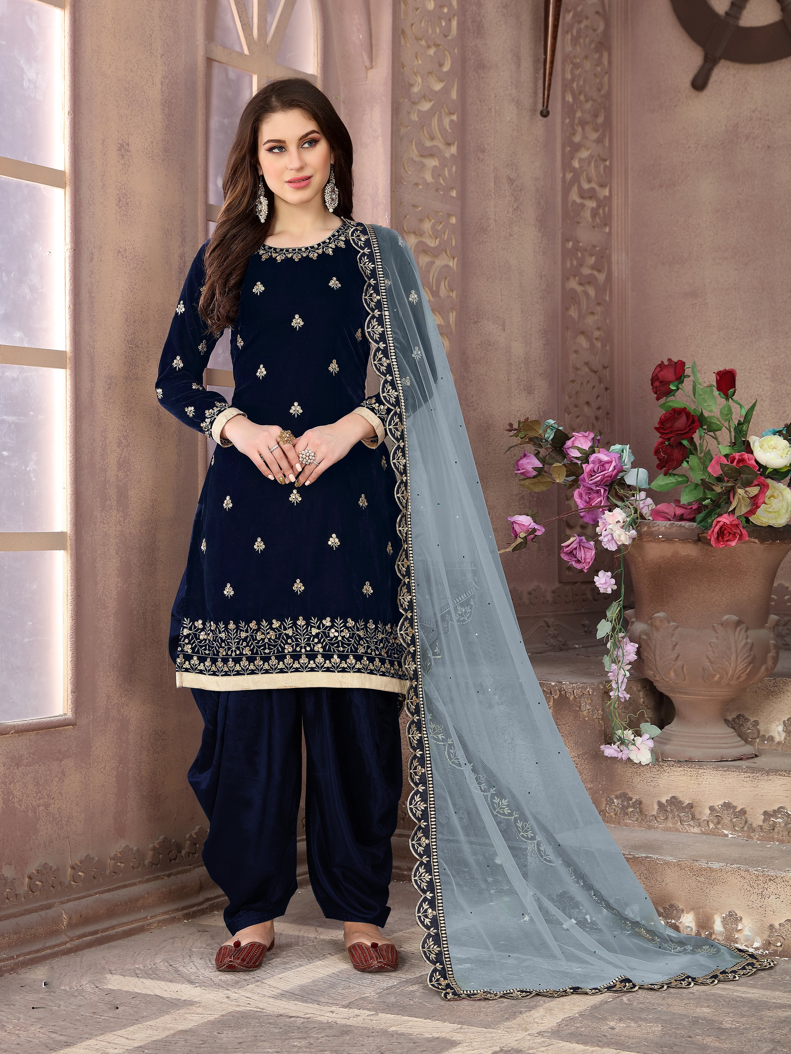 Dark blue velvet Patiala suit with detailed embroidery for festive occasions