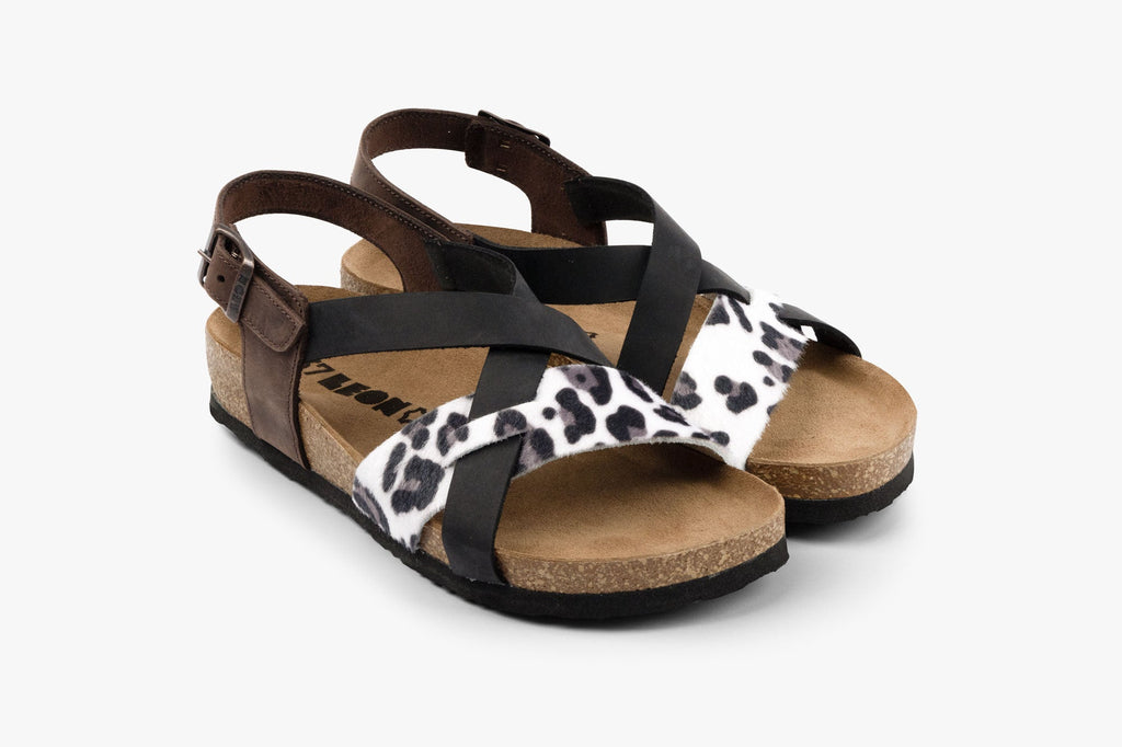 Women's orthopedic leather sandals in brown and black with animal print detail and adjustable ankle buckle.
