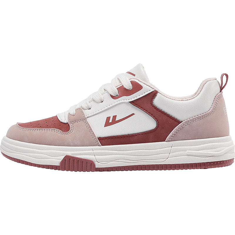 Casual red, pink, and white color block women's sneakers with white laces, side view on a clean background.