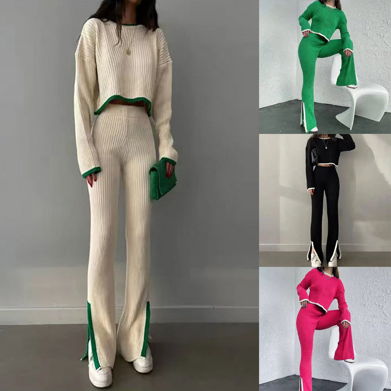 A woman wearing a beige and green color-block ribbed knit two-piece set featuring a long-sleeve crop top and matching slim pants with slit hems.