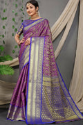 Purple Kanjivaram silk saree with zari woven design and contrasting blue blouse piece.