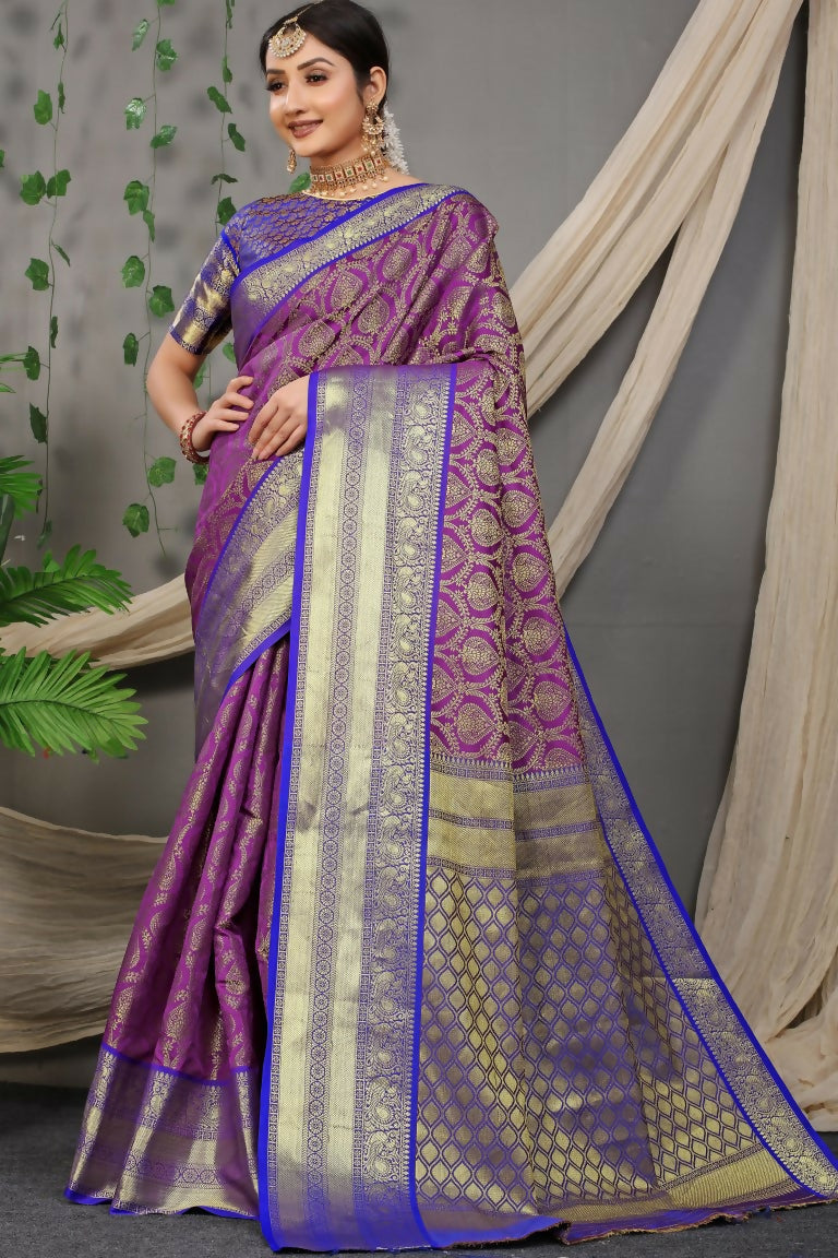 Purple Kanjivaram silk saree with zari woven design and contrasting blue blouse piece.
