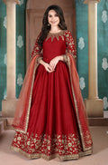 Red silk embroidered Anarkali suit with festive designer detailing.
