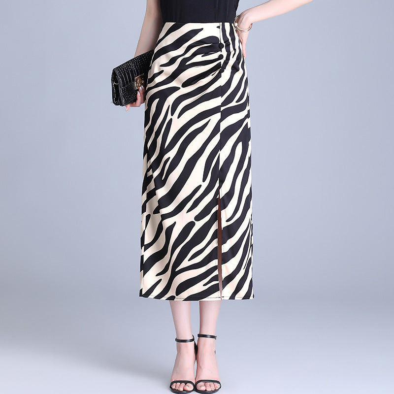 Close up of high-waist long skirt with black and white stripes and a hip split
