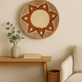 Savanna Sunburst wicker wall basket featuring geometric patterns in beige, terracotta, and brown earth tones.