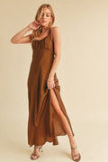 A summer maxi cami dress with side slit and sophisticated back cutout