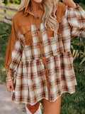 A woman wearing a plaid button-front mini dress with tan solid panels and chest pockets, paired with boots.