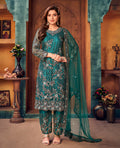 Elegant teal Pakistani salwar kameez in net fabric with intricate embroidery
