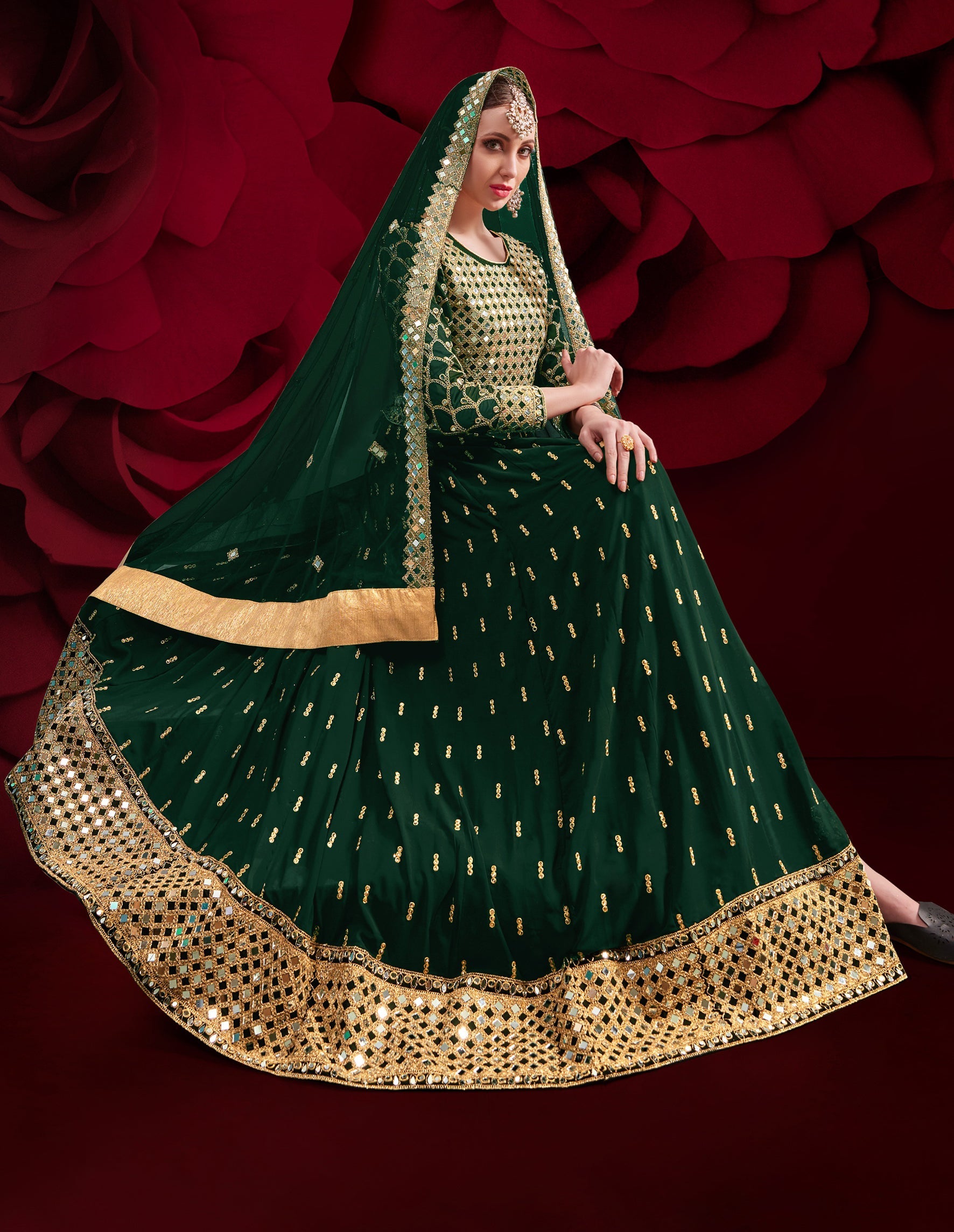 Elegant dark green georgette Anarkali salwar suit with detailed embroidery for festive occasions.