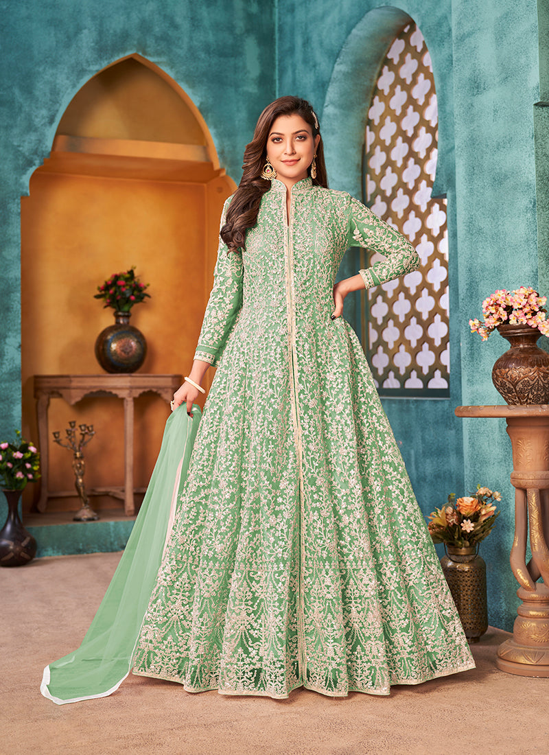 A stunning sea green floor-length designer suit in net with cord work embroidery.