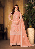 Peach color net palazzo suit with detailed zari embroidery for festive occasions