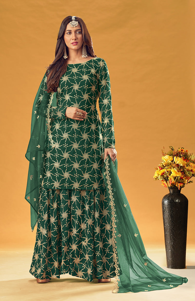 Woman wearing a Green embroidered faux georgette palazzo salwar suit set