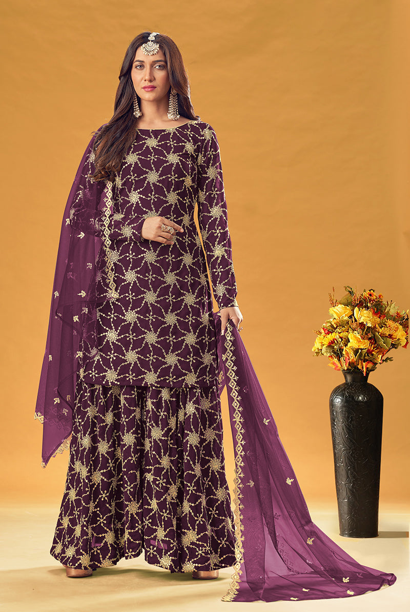 Purple embroidered palazzo salwar suit featuring detailed craftwork on faux georgette