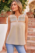 Woman wearing Josephine Stitch Sleeveless Shift Top in beige multi-color pattern