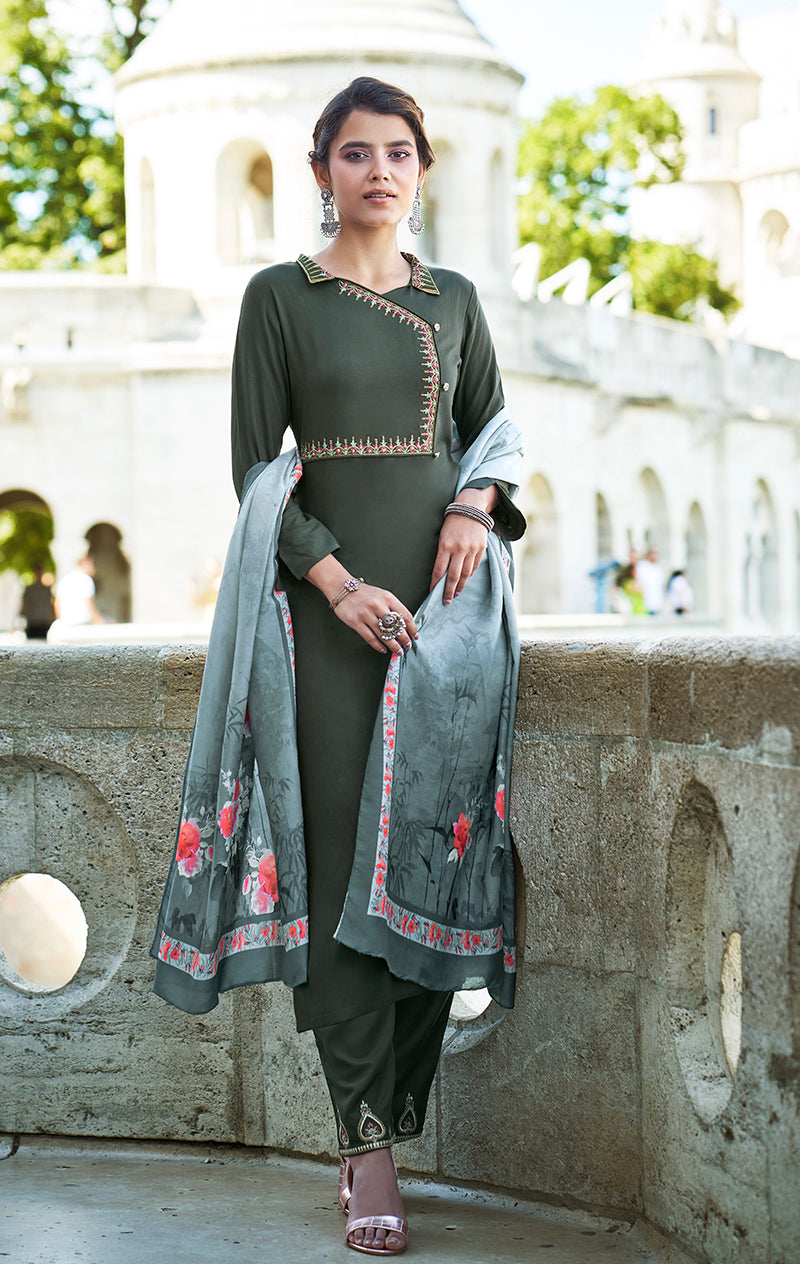 Dark sea green ceremonial salwar suit featuring elegant embroidery in a rayon-cotton blend.