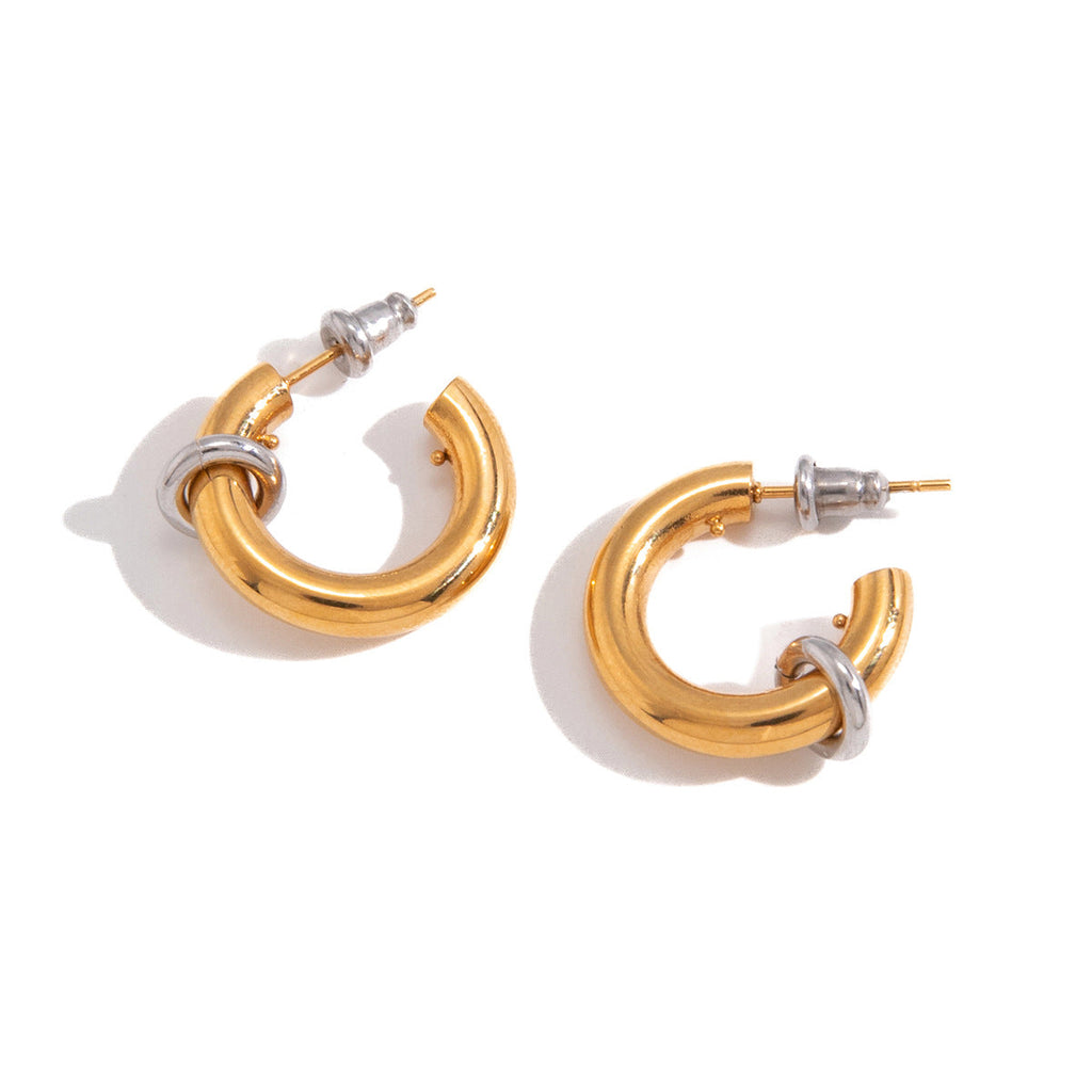 Polished two-tone stainless steel C-hoop earrings featuring a small ring accent by Vera Lux.