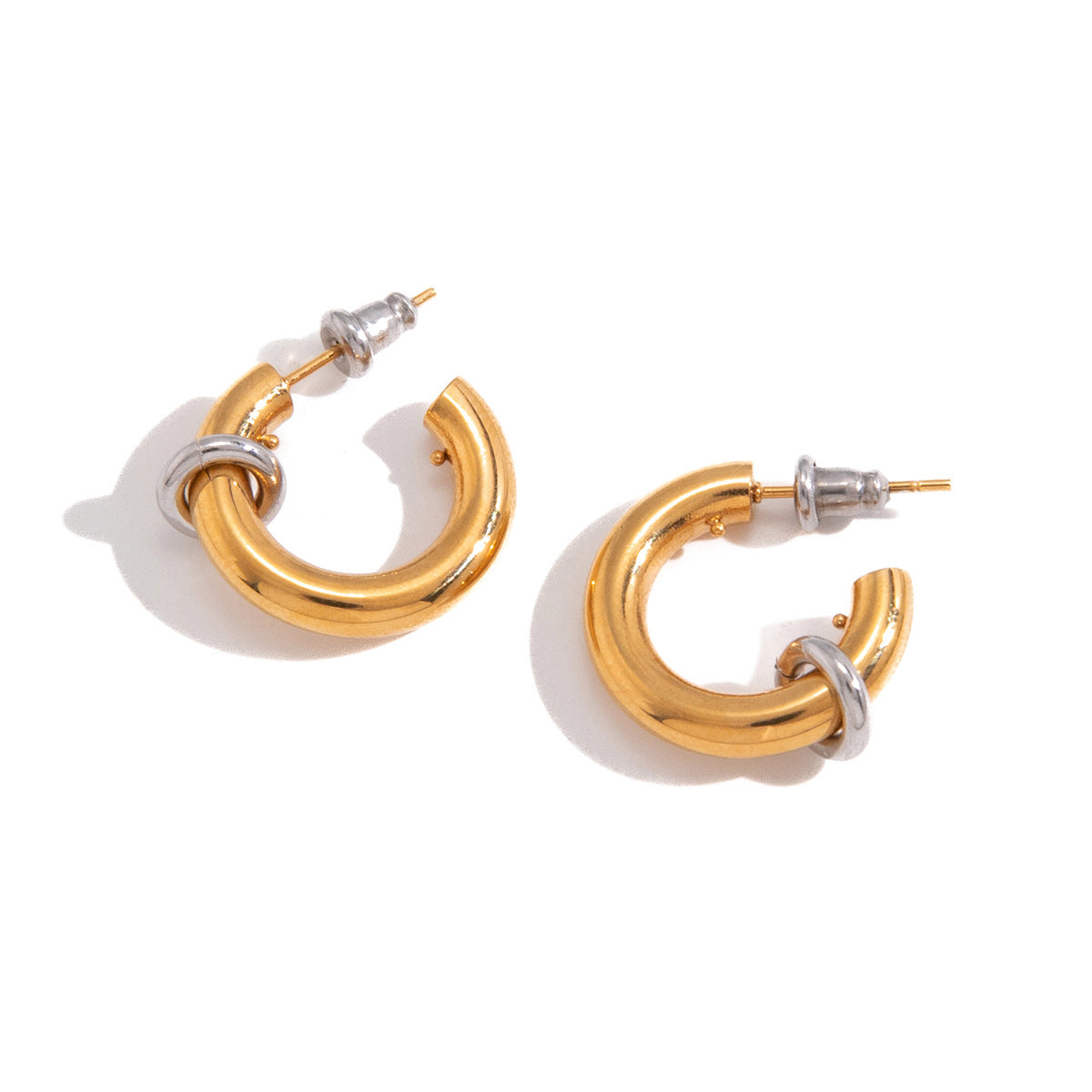 Polished two-tone stainless steel C-hoop earrings featuring a small ring accent by Vera Lux.
