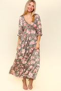 A feminine floral printed dress with a twisted waist detail and a ruffled hem