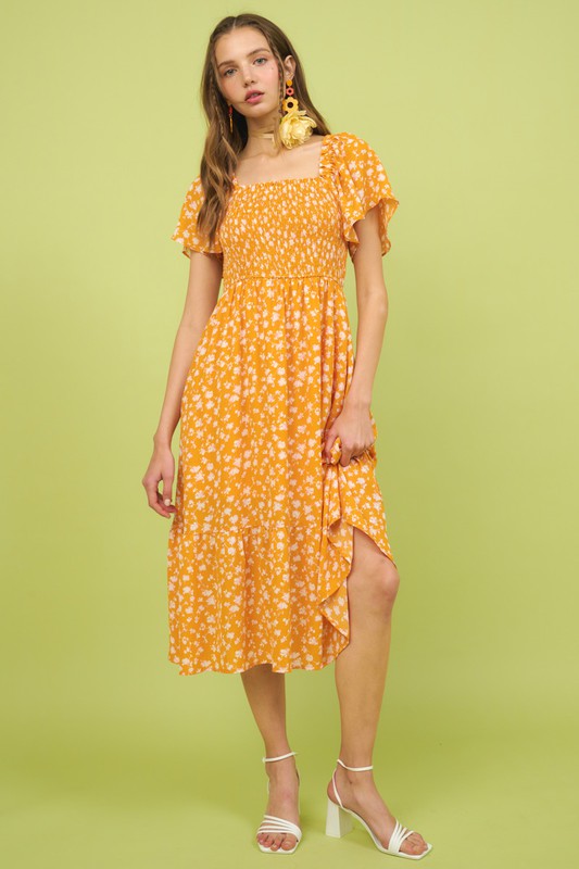 Floral print midi dress with flutter sleeves and smocked bodice by Stevvex