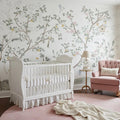 Quinlan chinoiserie floral wallpaper in sage-green, pale-pink, and soft-yellow on a white background.