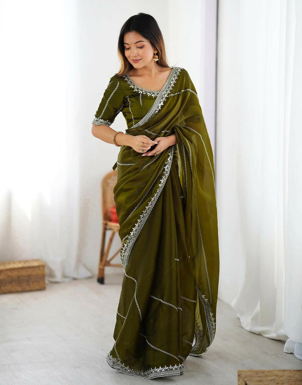 Olive Green tissue silk saree with intricate sequence embroidery work