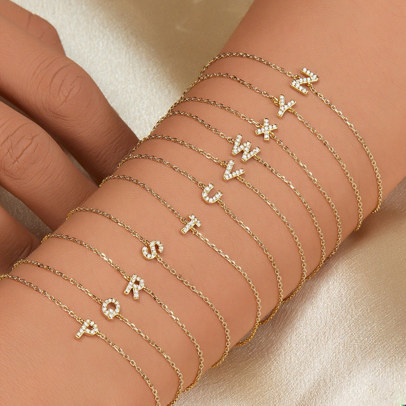 Close-up of a gold-plated minimalist letter bracelet with sparkling cubic zirconia on a wrist
