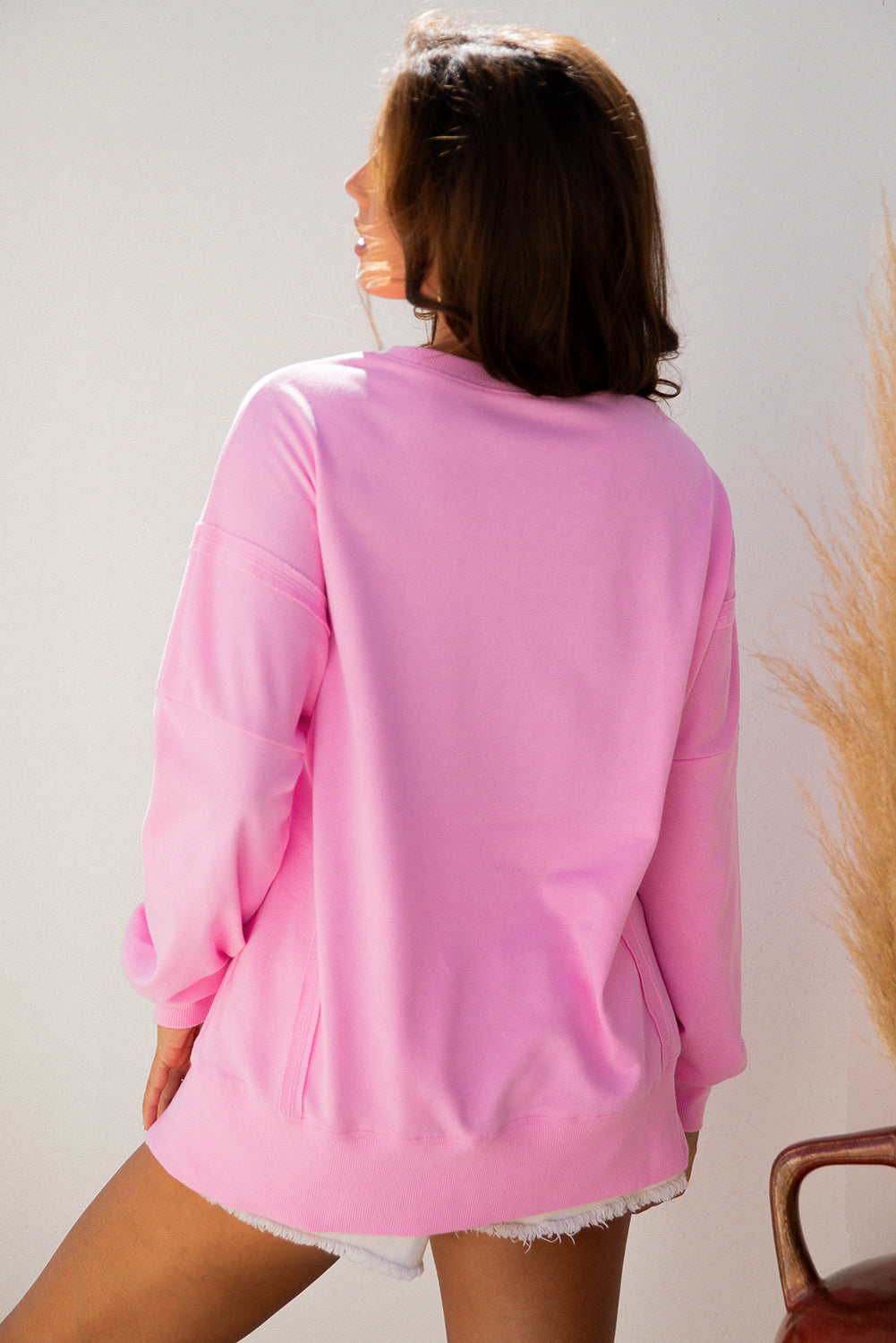 Pink Bow Sequin XOXO Baggy Sweatshirt | Exposed Seam Detail