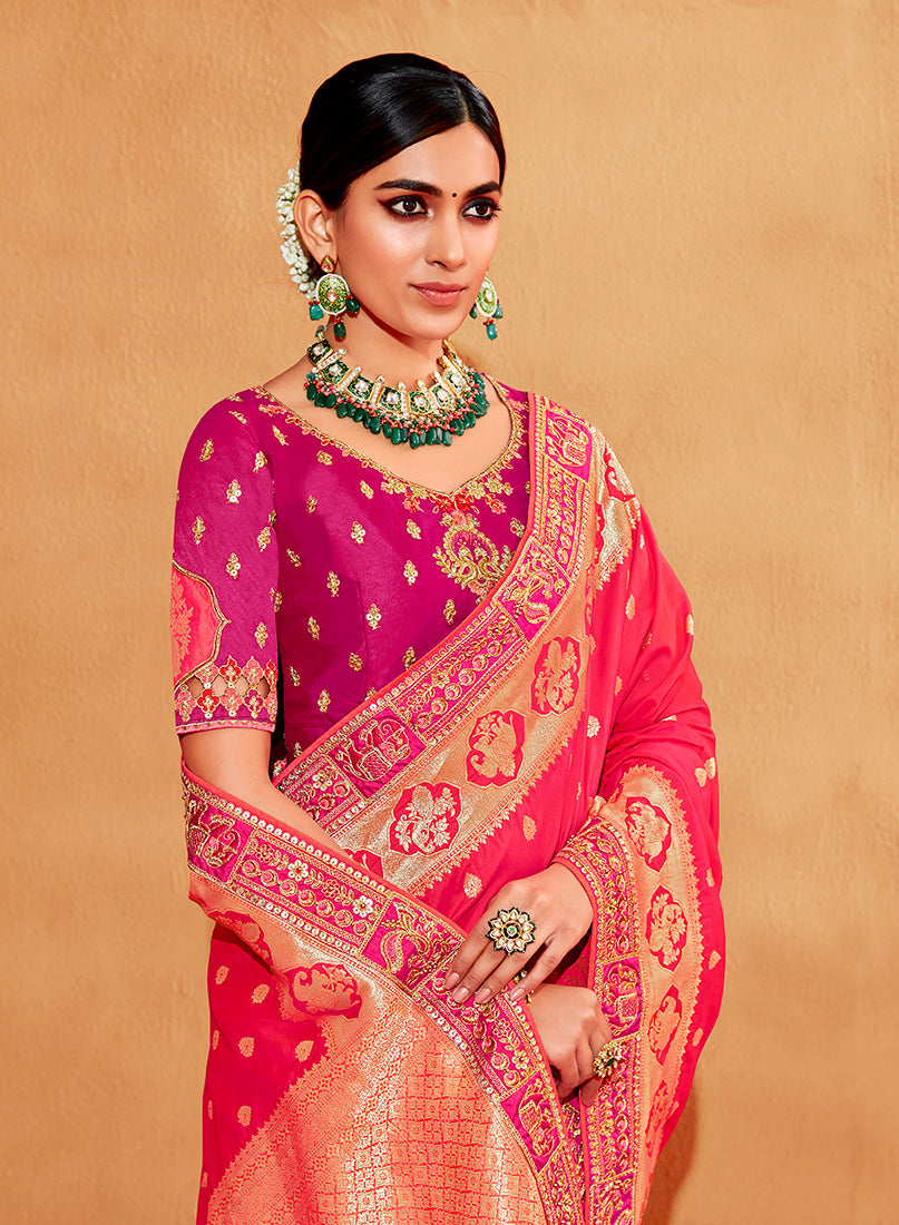 Pink heavy silk half and half saree with elaborate embroidery.