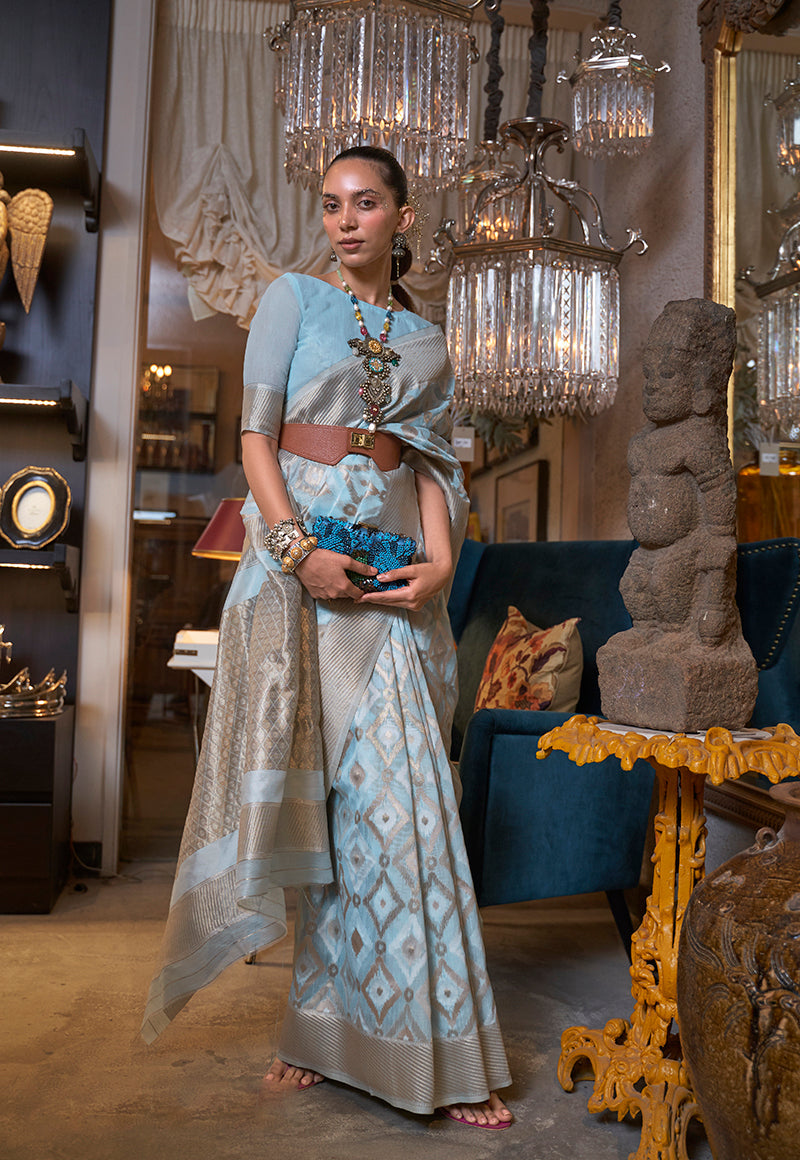 Sky blue linen saree with woven zari work and matching blouse piece