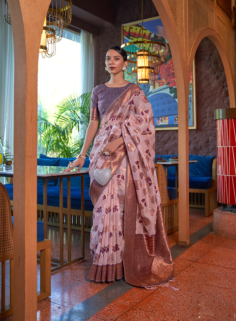 Light pink organza saree with contemporary weaving print and matching blouse