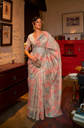 Elegant cream silk saree with printed patterns and a decorative border