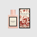Gucci Bloom Eau de Parfum bottle in powder pink with elegant floral packaging