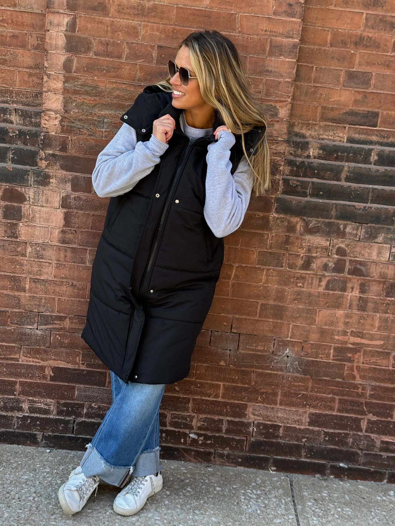 Long Black Puffer Vest with Removable Hood and Dual Closure