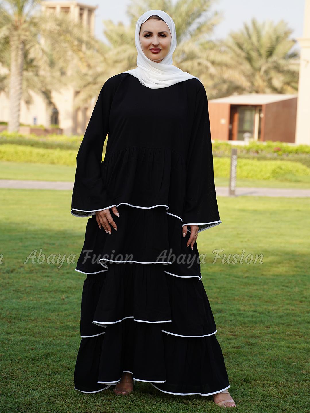 Abaya black with frill work in white Piping