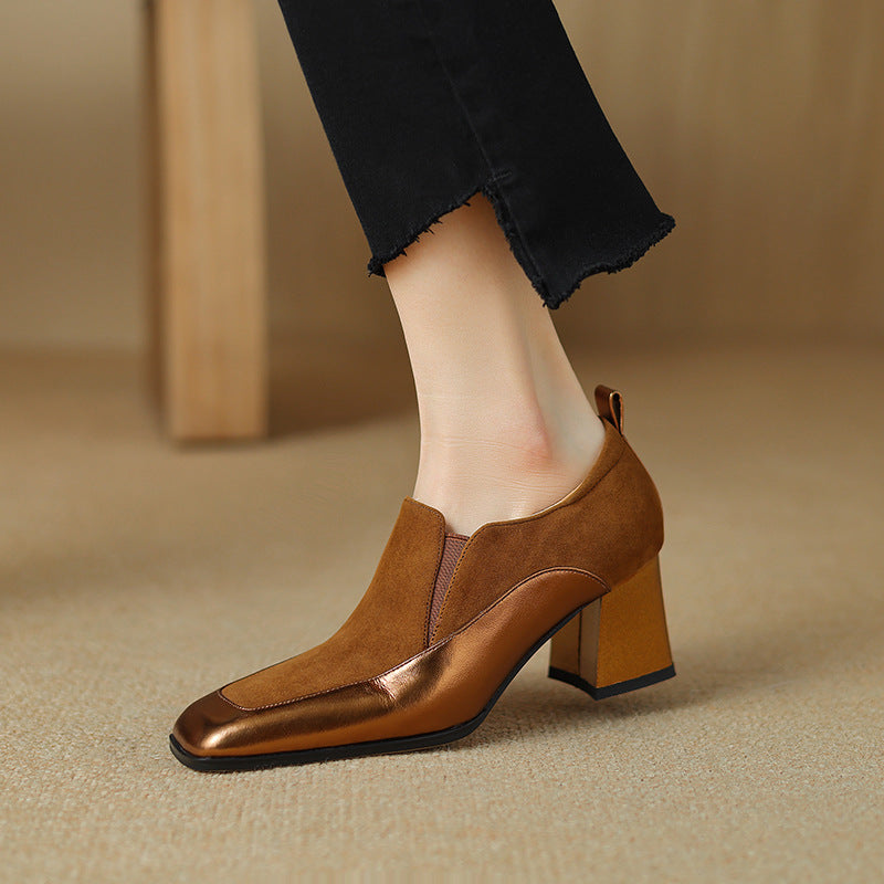 Close-up of women's bronze cowhide square toe chunky heel pumps on a neutral background.