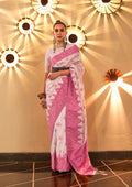 White handloom silk saree with intricate Banarasi patterns and a matching blouse